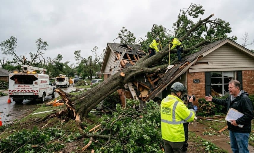 Large fallen tree damaging a home in Oklahoma after a severe storm while insurance claims are being assessed.
